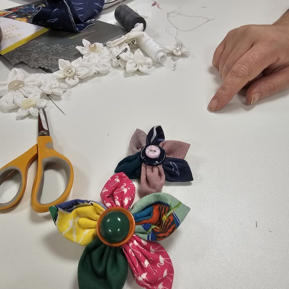 Workplace wellbeing workshop making flowers from fabric scraps