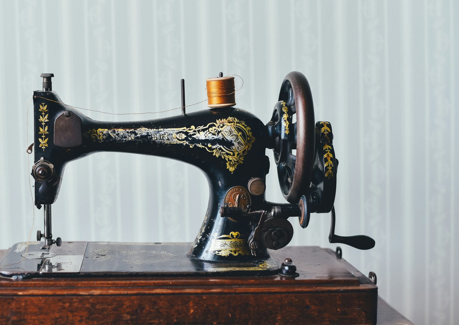 A Stitch in Time: Starting to Sew as a Child - image of an old hand crank sewing machine
